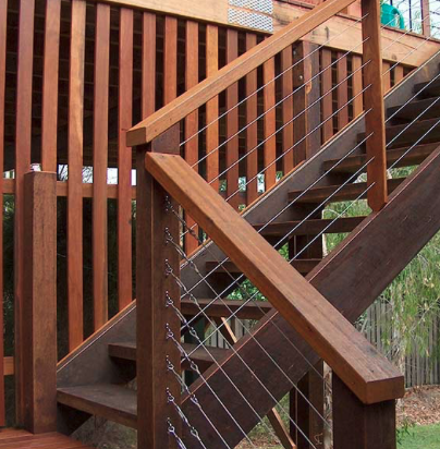 Stained hardwood stairs with cable railing in Hendersonville, TN